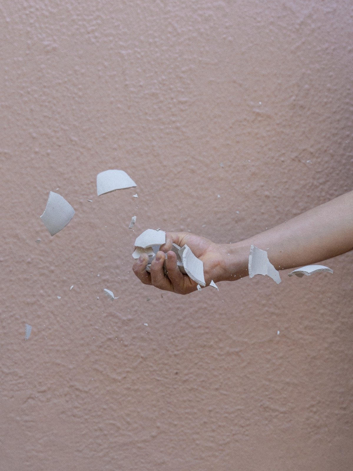 Hand scattering ceramic fragments